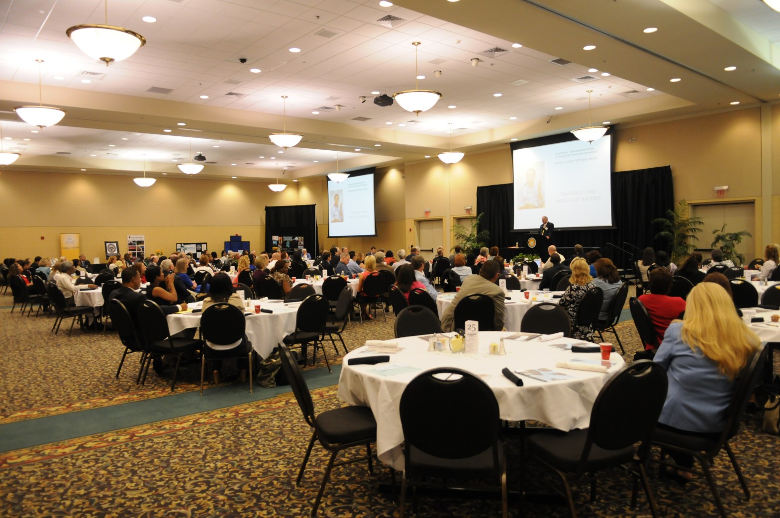 Photo of a large convention space with attendees